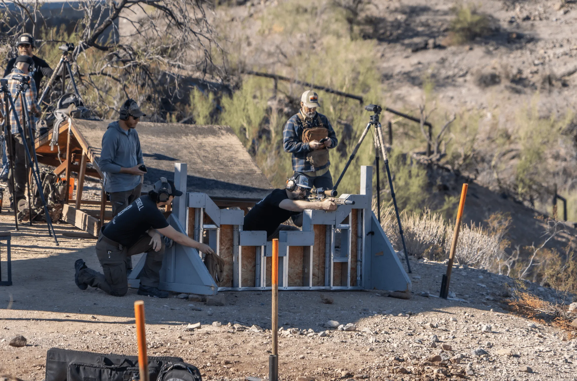 Shooters running dynamic barricade drills and practicing target engagement at Cowtown Range.