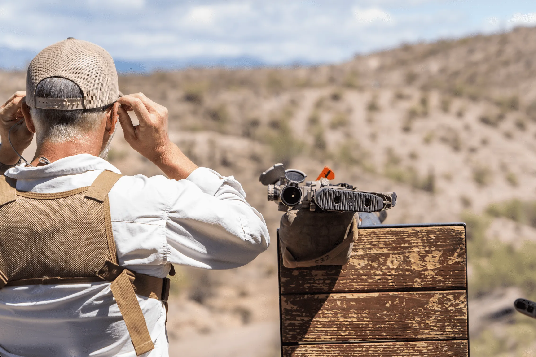 Precision rifle shooter at Cowtown Range preparing to engage long-range targets in Peoria, Arizona.